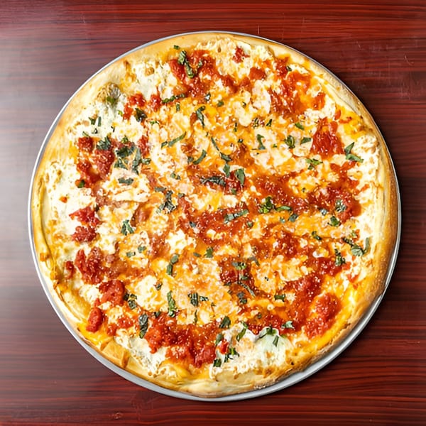 Big Joe's Pizzeria's white pizza with dollops of red sauce and fresh basil on a wooden table.
